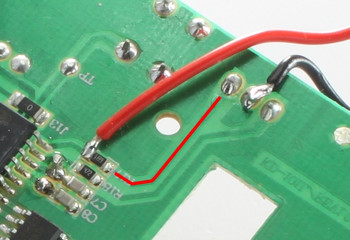 Smoke detector opened with soldered LED closeup